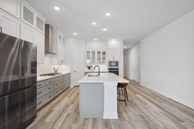 Kitchen with light hardwood / wood-style flooring,