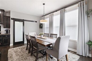 Very inviting Dinning Area draped by large windows