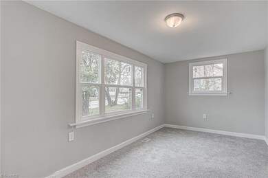 Living room also features large replacement windows.