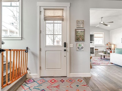 Foyer entrance with vaulted ceiling, wood finished