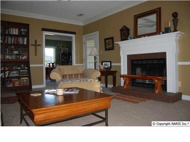LIV ROOM ALSO HAS FIREPLACE AND DOORWAY LEADS TO SIDE SITTING DECK