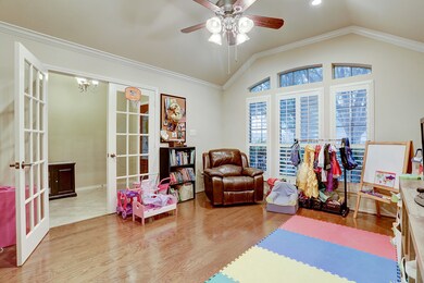 This bright office/living room has privacy doors and a large window looking to the front yard.