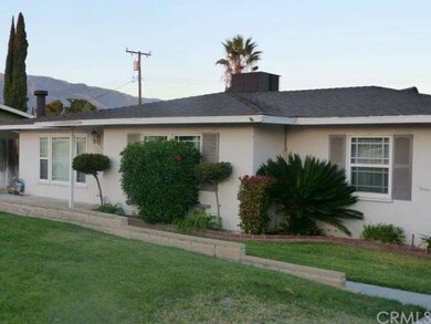 VIEW OF FRONT WITH MOUNTAINS IN THE BACK--AND SIDE