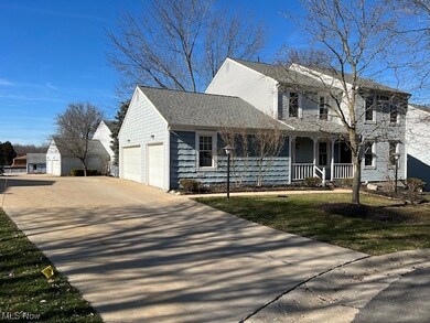 View of front of house with a garage and covered porch