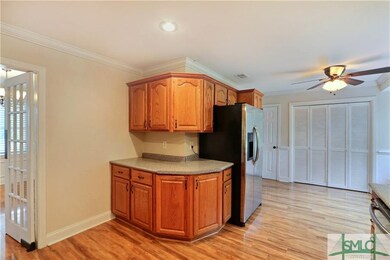 Kitchen with Washer/ Dryer utility room behind lou