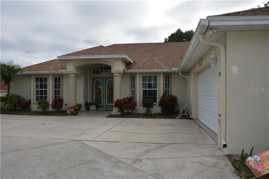 EXTERIOR FRONT WITH SIDE ENTRANCE GARAGE AND CIRCU