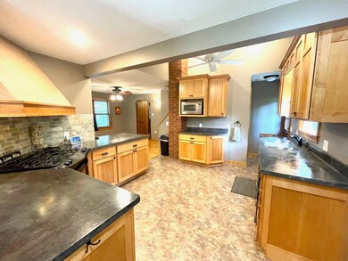 Such a beautiful kitchen! Nice concrete countertops, great lighting, tasteful backsplash, custom cabinetry and more!