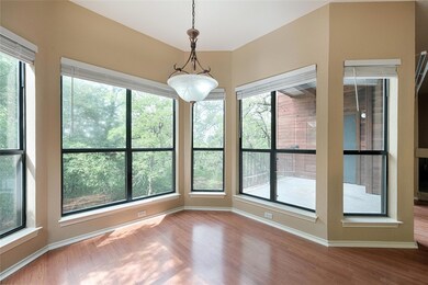 Unfurnished sunroom with wood finished floors