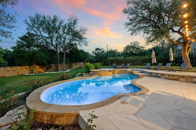 View of pool with a patio area, a lawn, and a poo