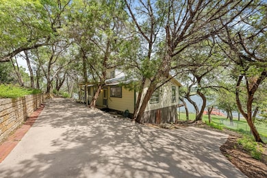View of home's exterior featuring concrete drivew