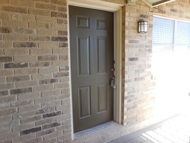 Property entrance with brick siding
