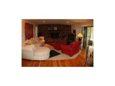 Family room -hardwood floors and a fireplace