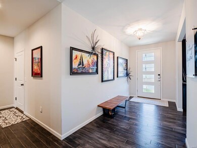 Large entry foyer with custom front door and 11 ft