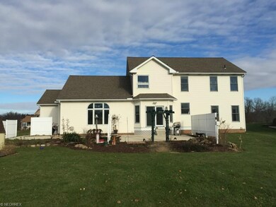Back View.  Nice patio and privacy fencing