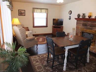 Living room with hardwood floor, picture window an