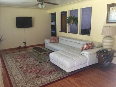 Light and bright open living room with hardwood fl