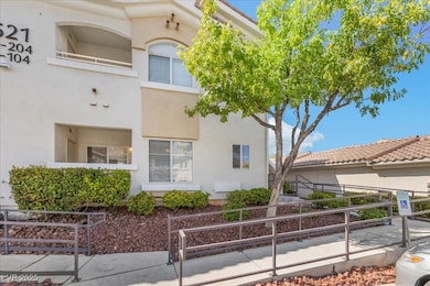 View of property exterior featuring stucco siding and a fenced front yard