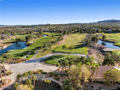 Aerial perspective of suburban area featuring a water and mountain view and a golf club