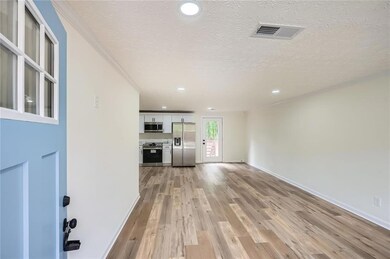 Unfurnished living room with recessed lighting, li