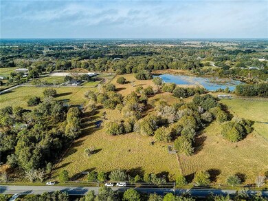 White cars in front of 10.3 acre property and  4.9
