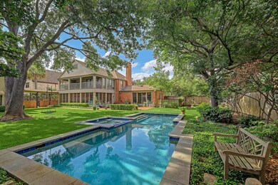 The positioning of the pool provides an impressive green space as a meeting space between the home and guest quarters. The 2 car detached garage is oversized and has plenty of room for overflow storage.