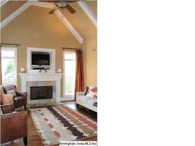 Keeping room off kitchen with vaulted ceiling.