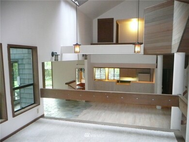 From the fireside room you look onto the general great room with living area just ahead and then the kitchen with eating area. To the left is the sun room and access to the outside with decks, hot tub and more. On the right is the formal dining area with its private deck and access to the kitchen, office/bedroom, pantry, 1/2 bath and access to the outside. The stairway to the upper floors is also on the right.