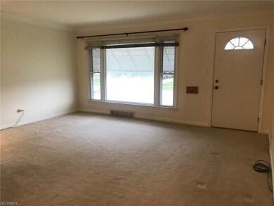 This inviting living room has neutral decor with p