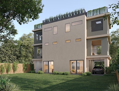 Rear view of property featuring stucco siding