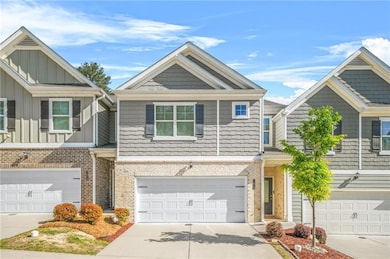 Townhome / multi-family property featuring drivewa