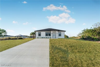 View of front of property with a front yard