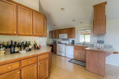 Storage abounds in kitchen - built in desk and noo