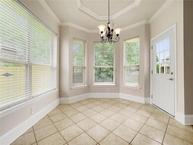 Breakfast nook with windows looking out into the b