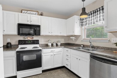 Crisp white cabinets make this kitchen a bright an