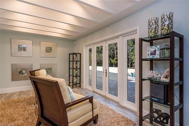 Sun Room/Living Room with a Wall of French Doors O