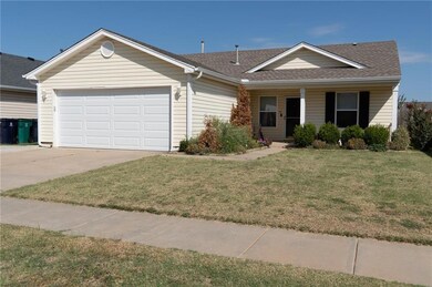 Single story home featuring a garage and a front l