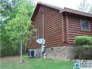 Log home with stacked stone