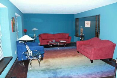 Living Room. Hardwood floors & large recessed wind