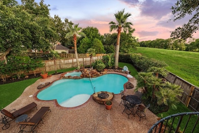 Take in the panoramic views from this elevated vantage point, showcasing a beautifully designed pool and lush green space. The backyard offers plenty of room for outdoor activities and entertaining, making it the perfect spot for enjoying sunny days and starry nights.