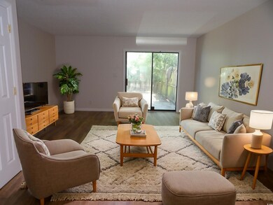 Living room featuring dark hardwood / wood-style f