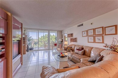 Large and spacious living room with white tile flo