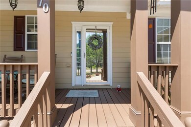 View of exterior entry featuring a porch