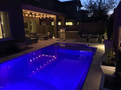 Pool facing BBQ and sofa