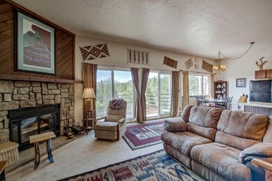 Carpeted living area featuring healthy amount of n