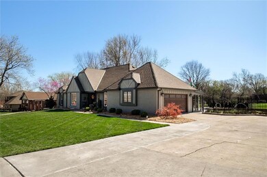 View of front of house with a front lawn and a garage