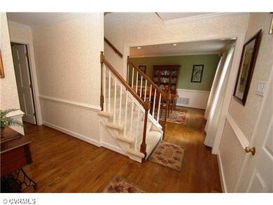 Foyer - Hardwood floors and crown and chair rail m