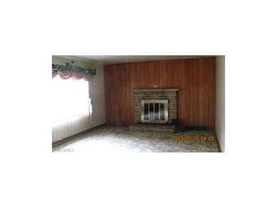 wood burning fireplace in this spacious living roo