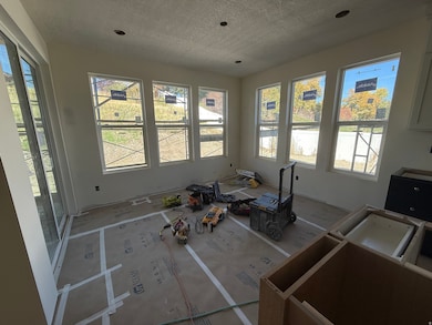 Unfurnished living room with a textured ceiling