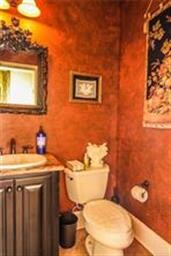 The powder room offers dramatic faux painting.