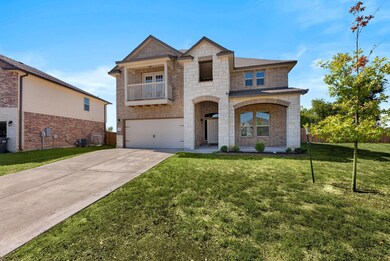 View of front facade featuring a garage and a fron